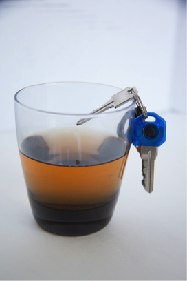 car keys and an alcoholic beverage